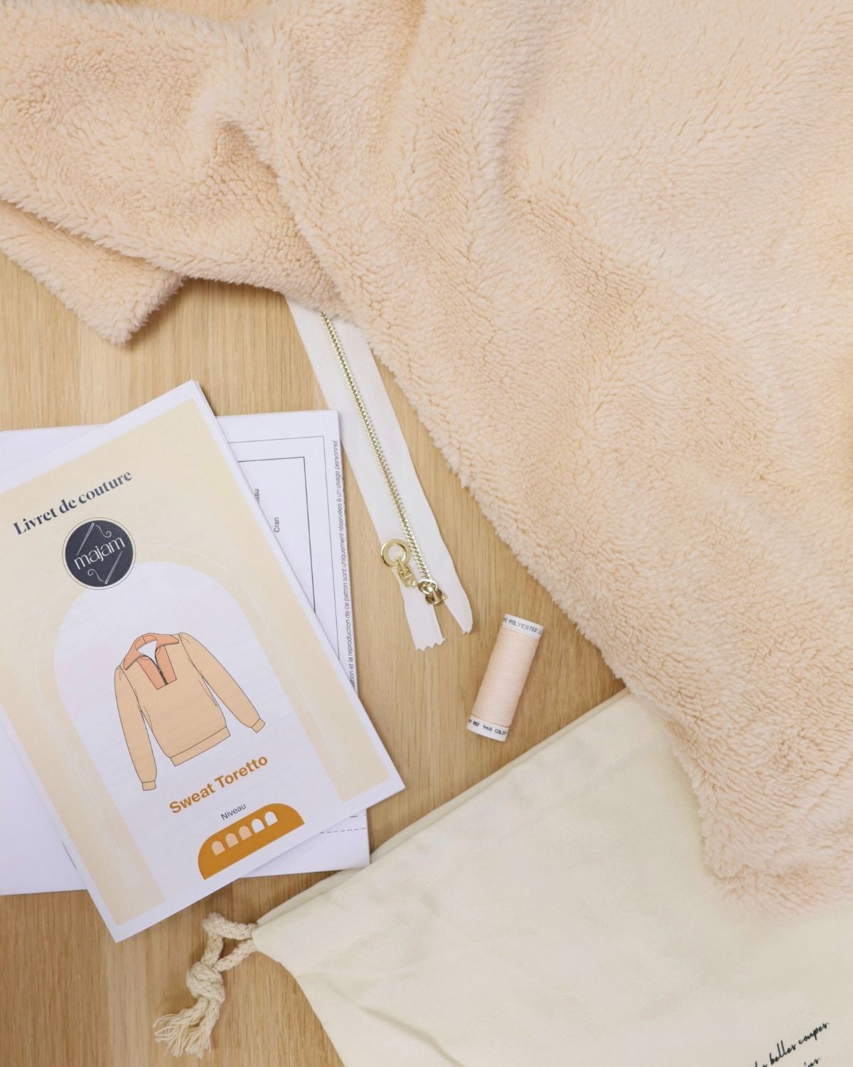 Pull-Toretto-sherpa-ivoire-contenu